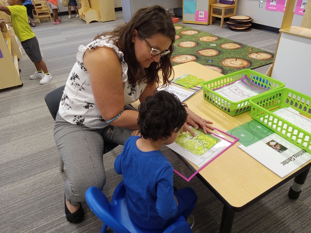 Mrs. Damm working on letter recognition
